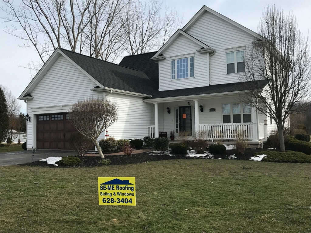 Home with new siding by SE-ME Roofing